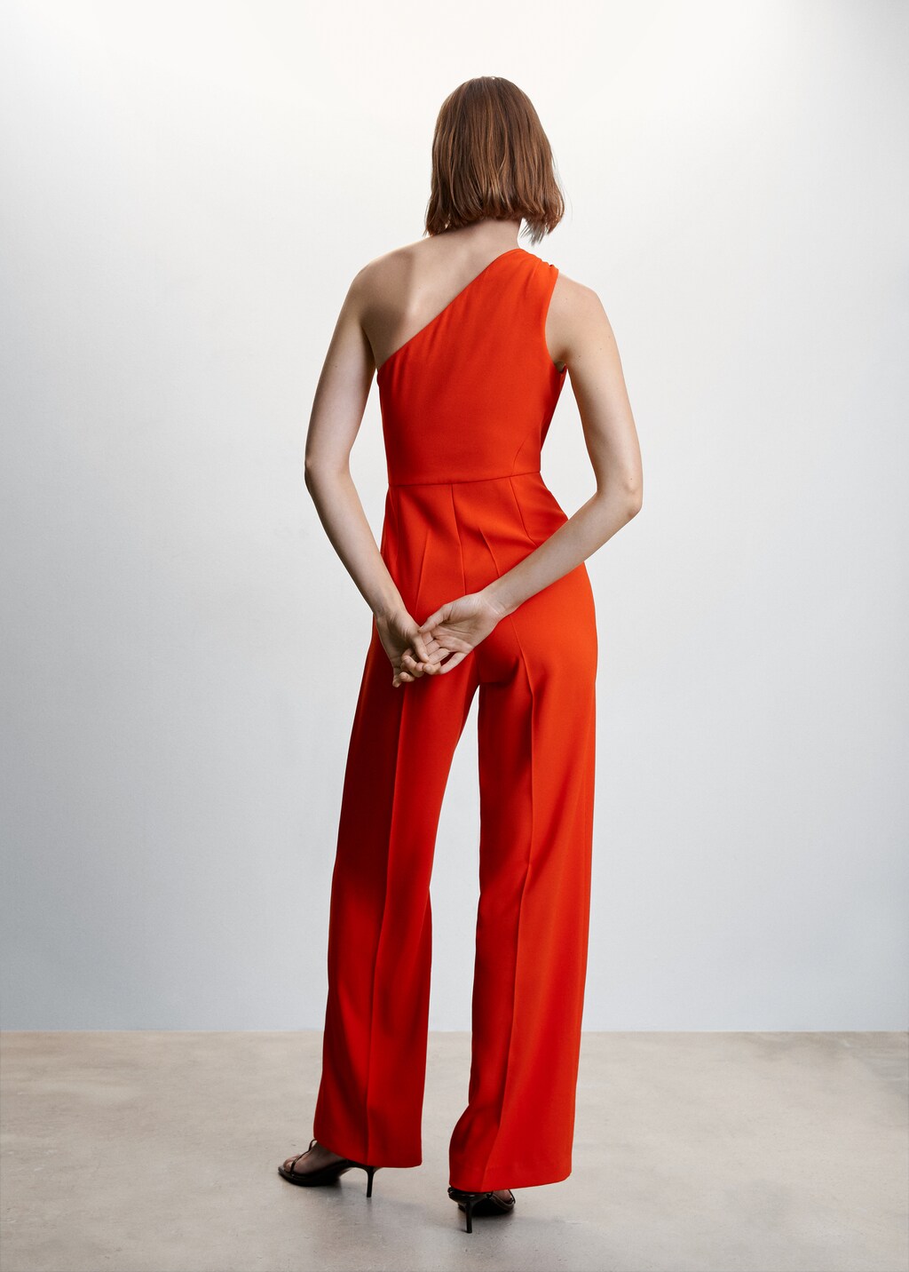 Asymmetrischer Jumpsuit mit Metallic-Detail - Rückseite des Artikels