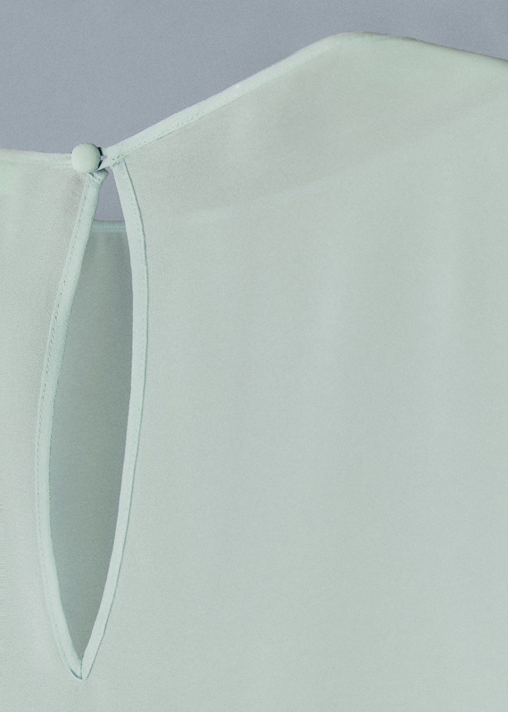 Asymmetric semi-transparent cape - Details of the article 8