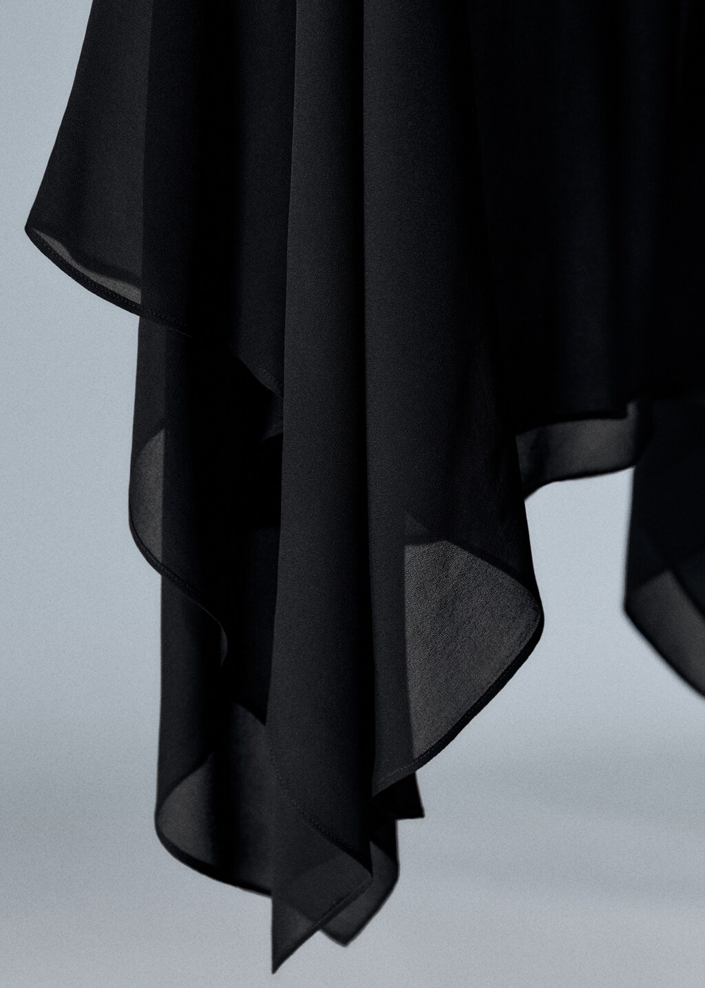 Asymmetric semi-transparent cape - Details of the article 8