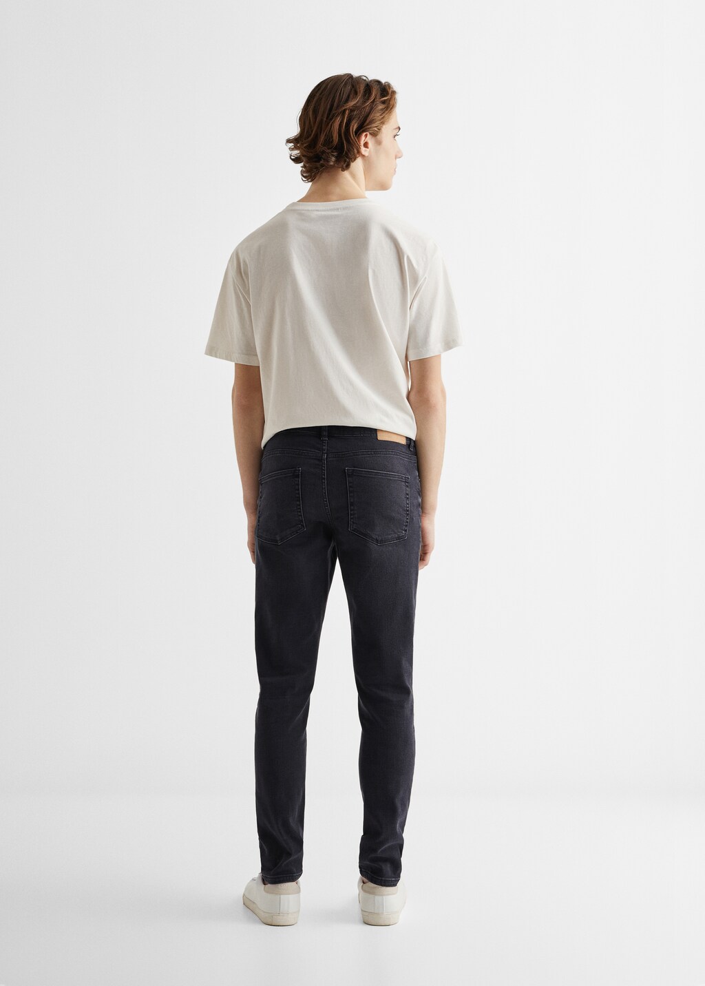 Slim-fit jeans with buttons - Reverse of the article