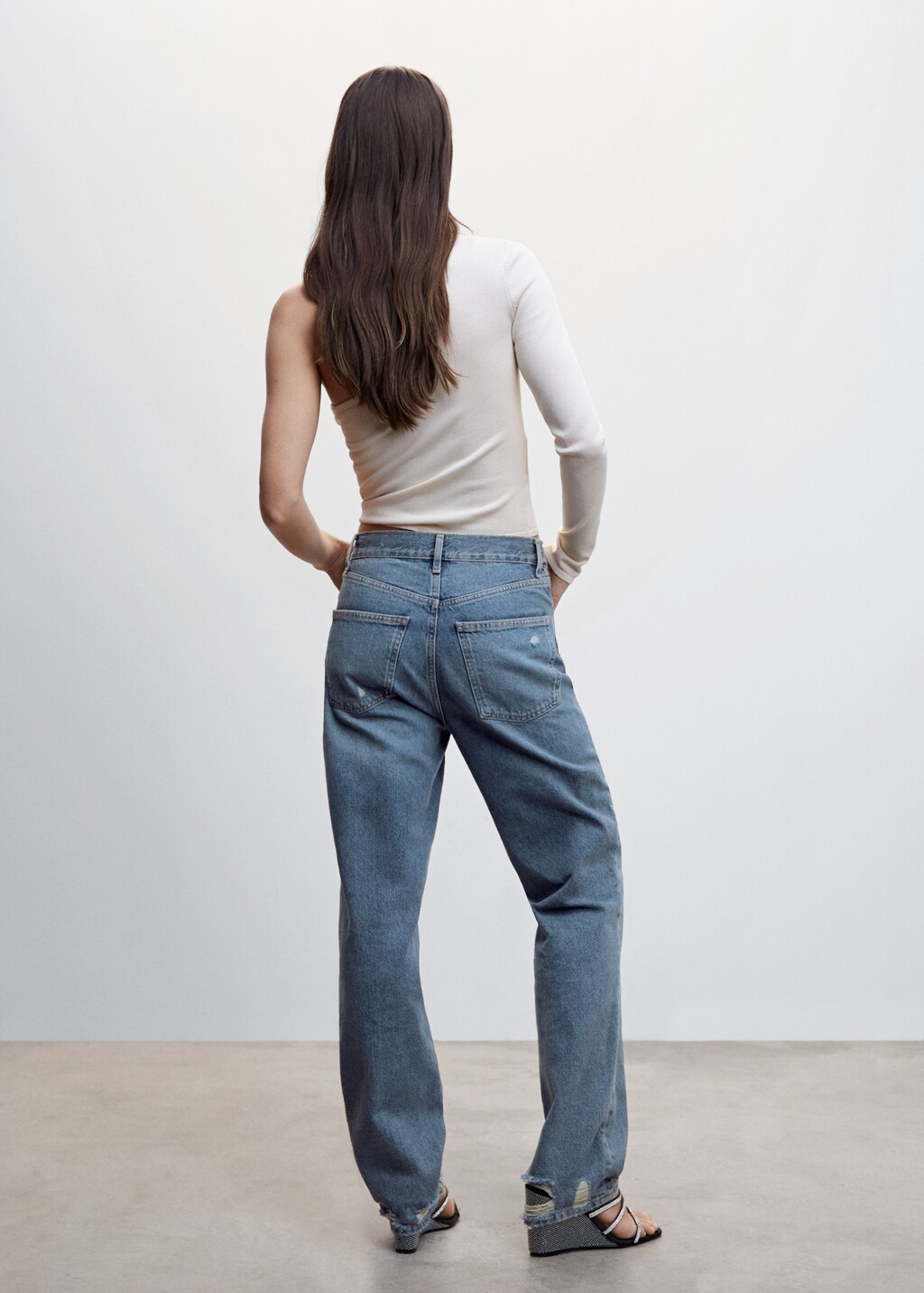 Ripped high-rise straight jeans - Reverse of the article