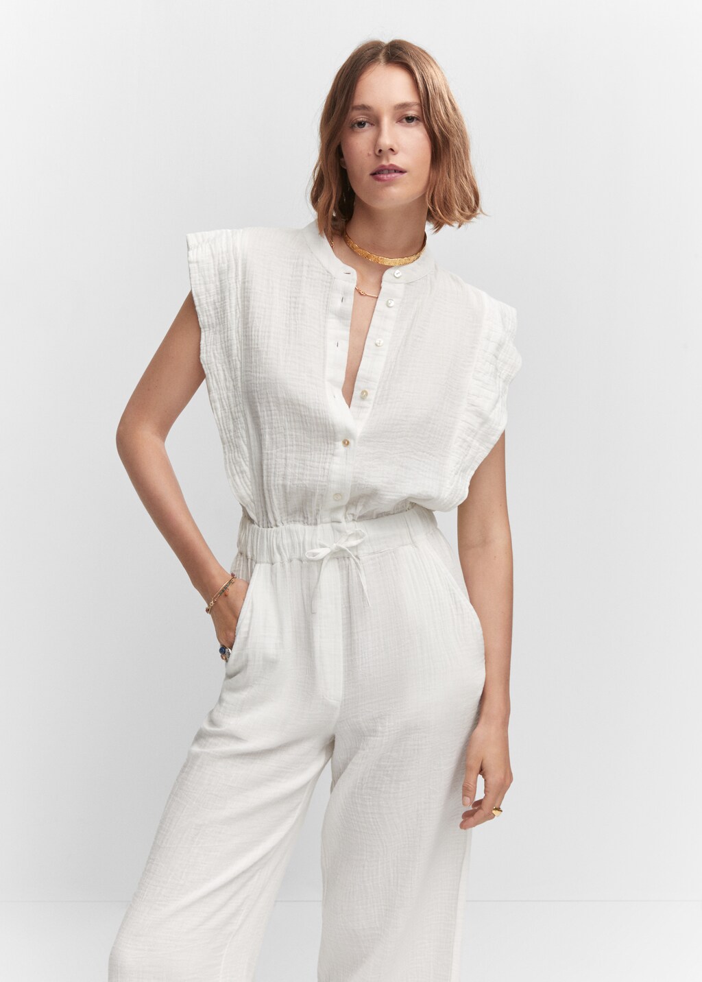 Textured jumpsuit with button - Medium plane