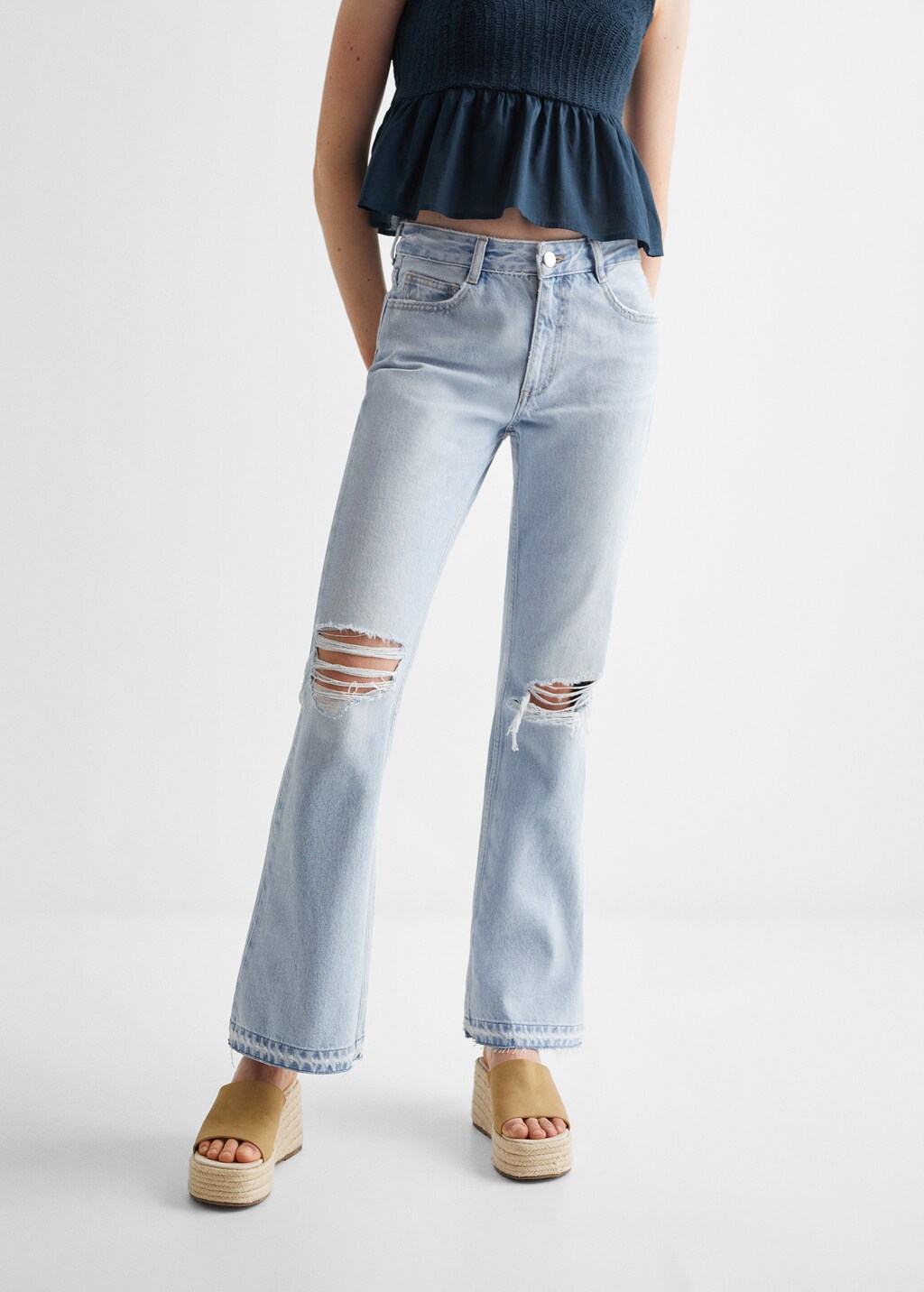 Flared jeans with decorative rips - Medium plane