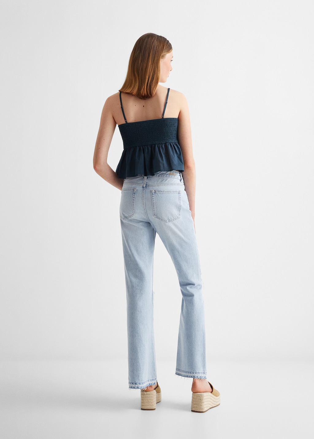 Flared jeans with decorative rips - Reverse of the article