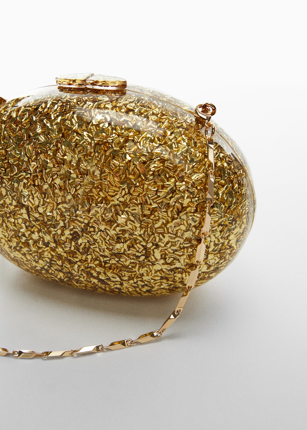 Onbuigzame clutch met ketting - Detail van het artikel 1