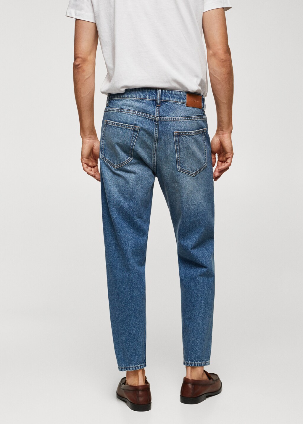 Medium-wash tapered-fit jeans - Reverse of the article