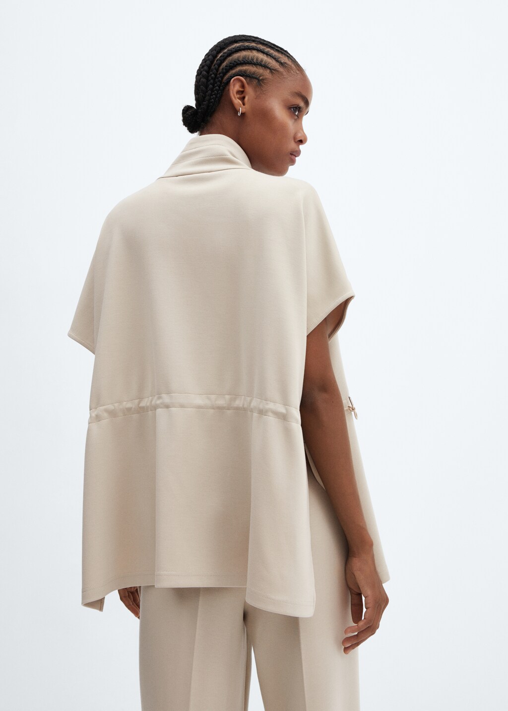 Poncho jacket with flap pockets  - Reverse of the article