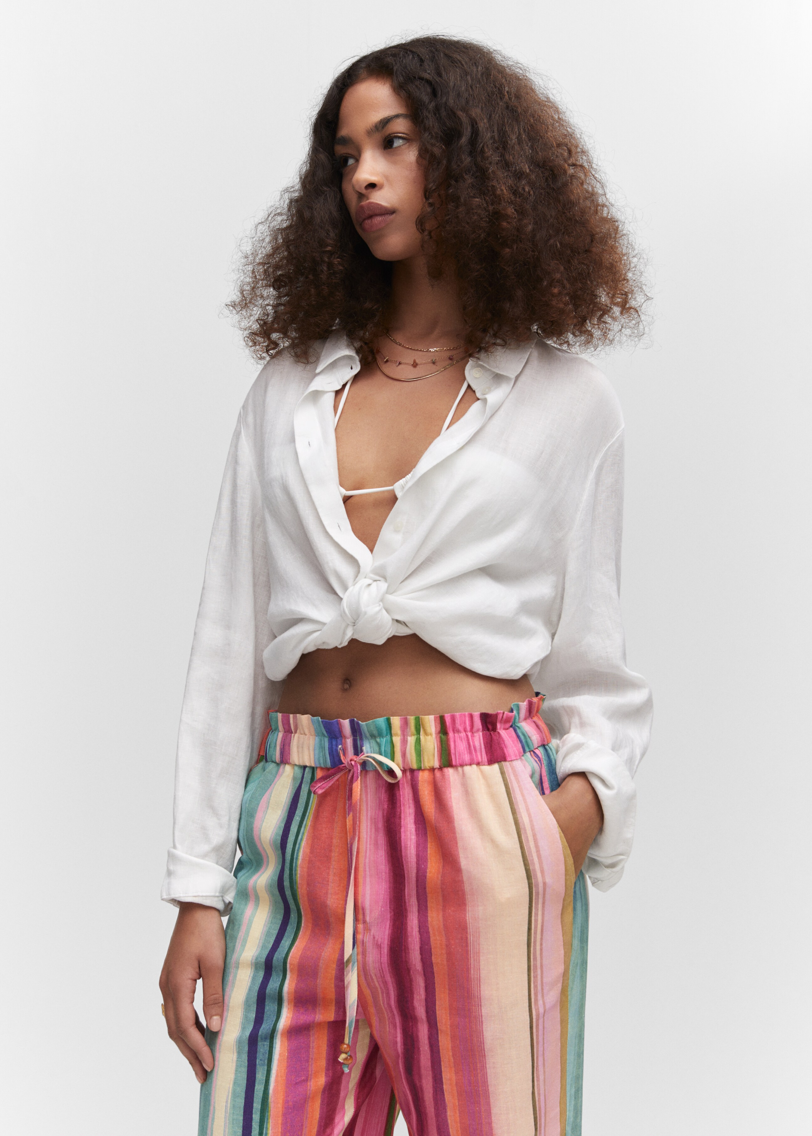 Multi-coloured striped linen trousers - Details of the article 1