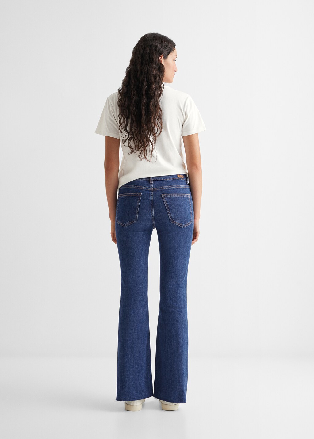 Frayed finish flare jeans - Reverse of the article