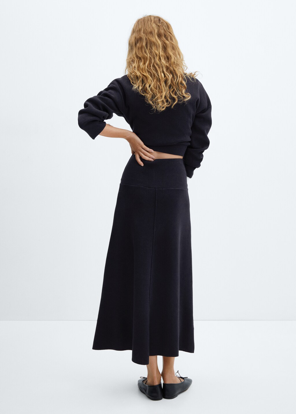 Flared knitted skirt with decorative seams - Reverse of the article