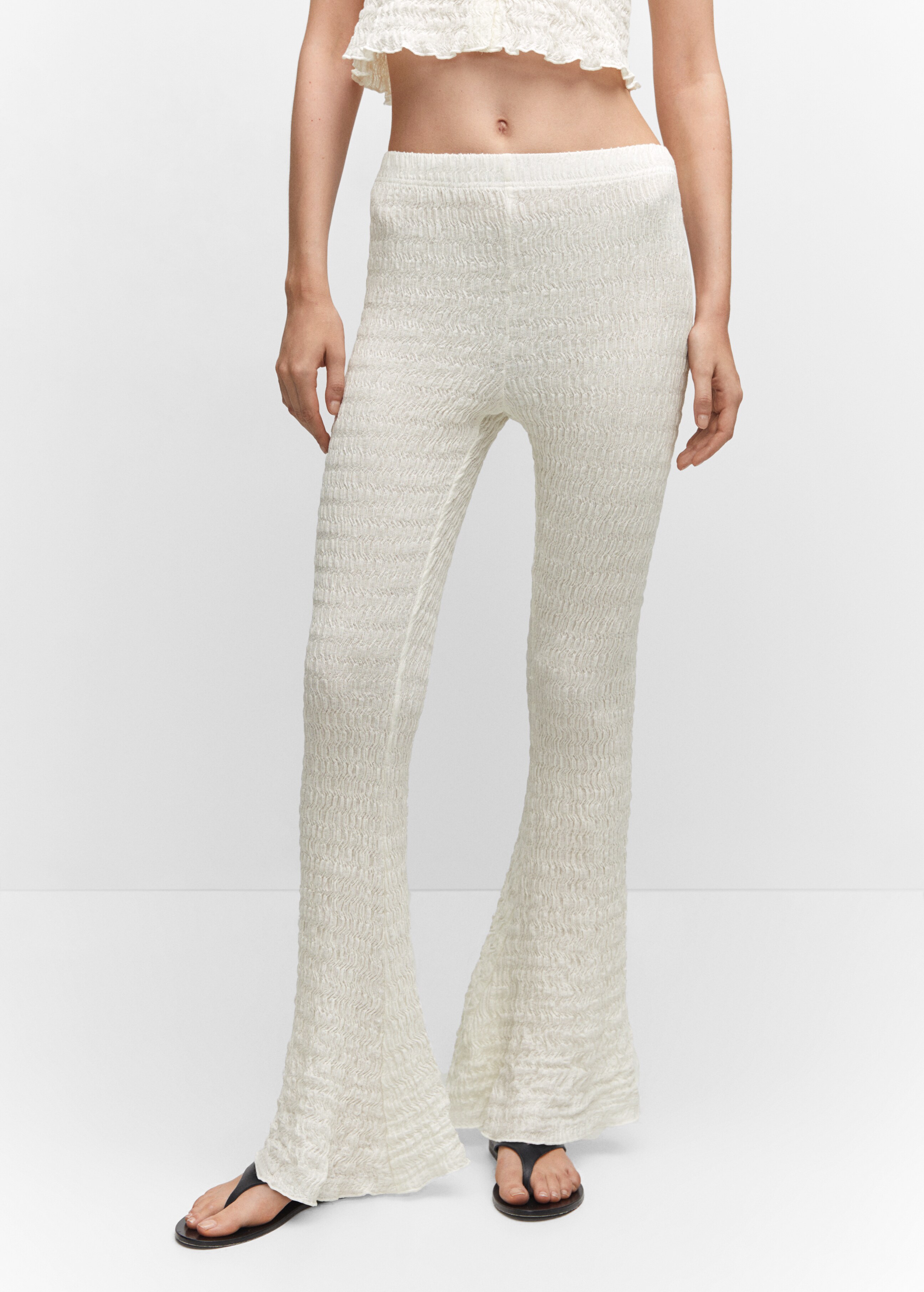 Flared textured trousers - Details of the article 6
