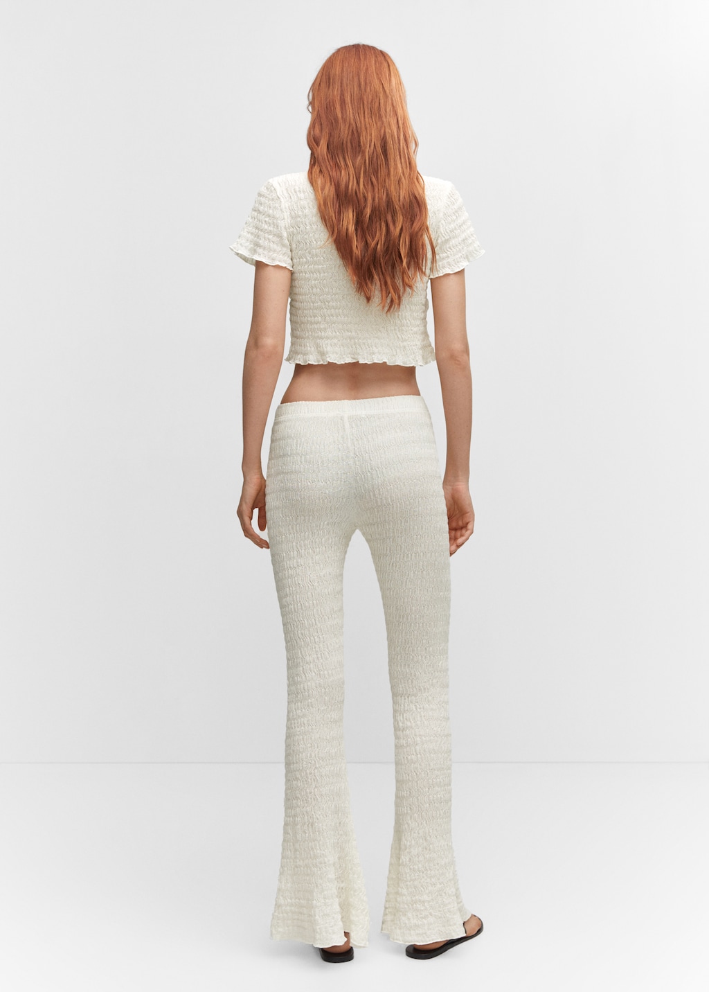 Flared textured trousers - Reverse of the article