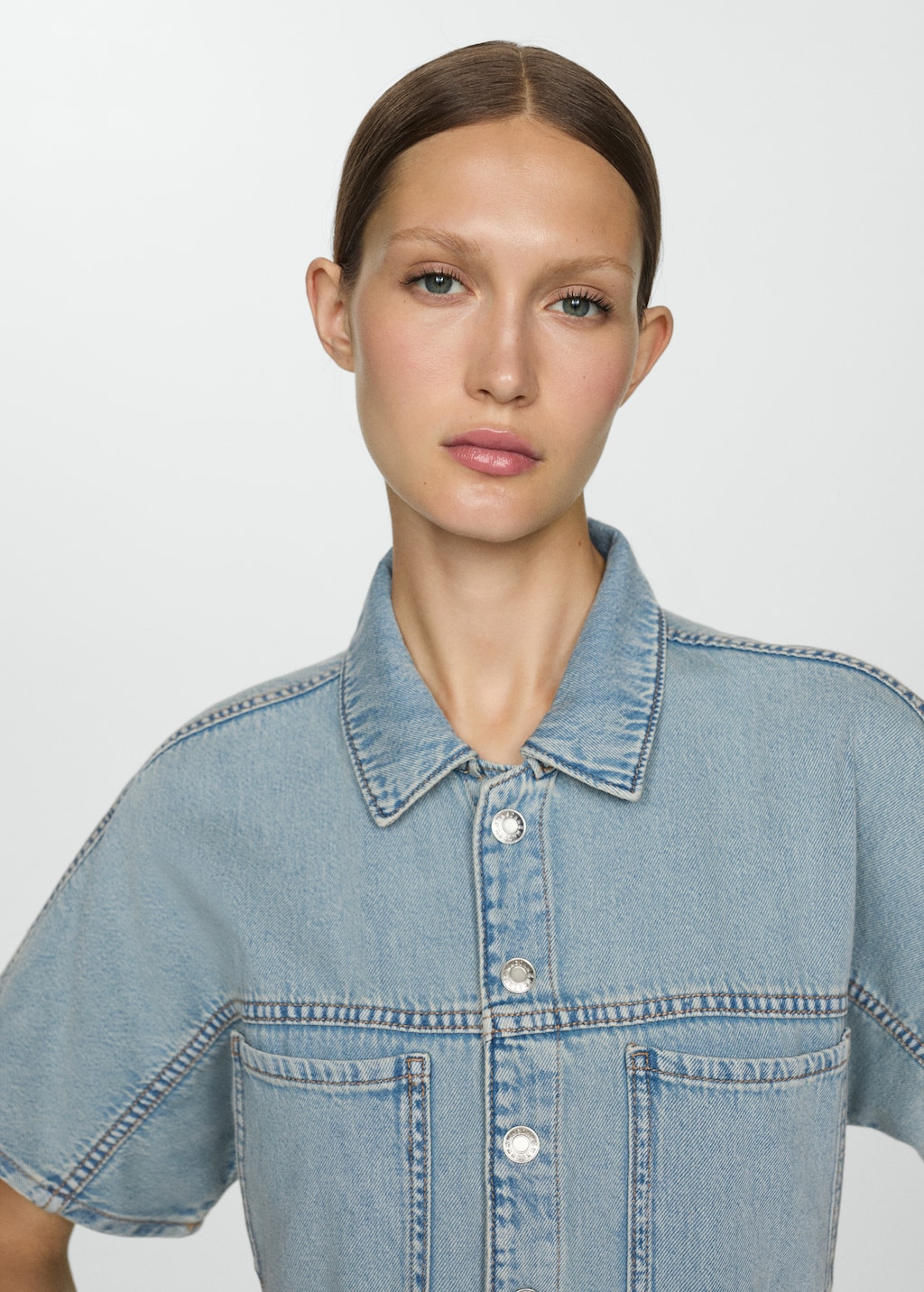 Denim jumpsuit with multi-position buttons - Details of the article 1