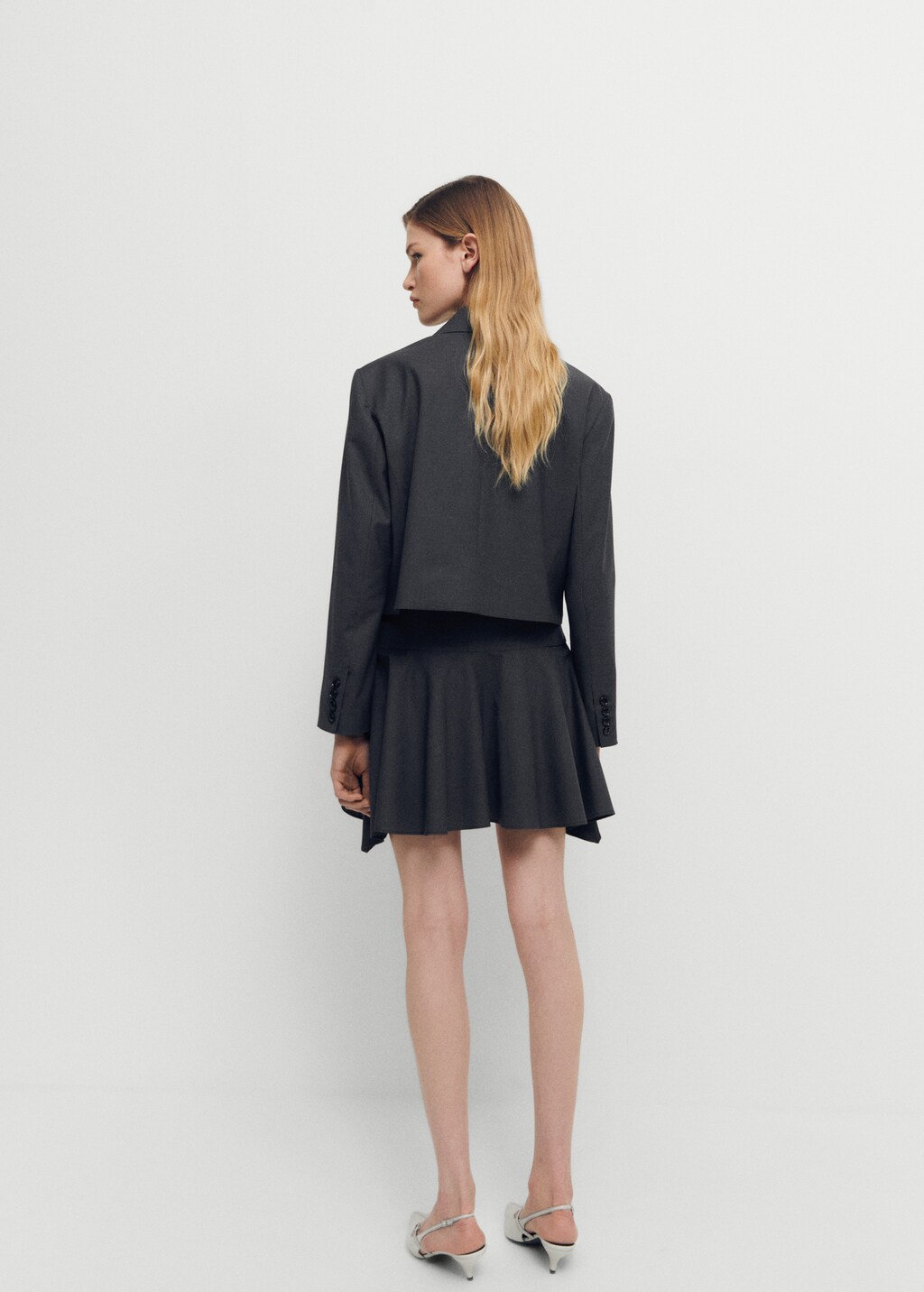 Wool mini-skirt with asymmetrical hem - Reverse of the article