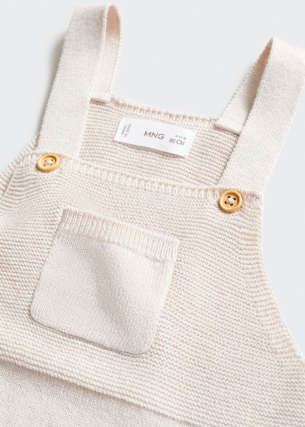 Long knitted dungarees - Details of the article 0