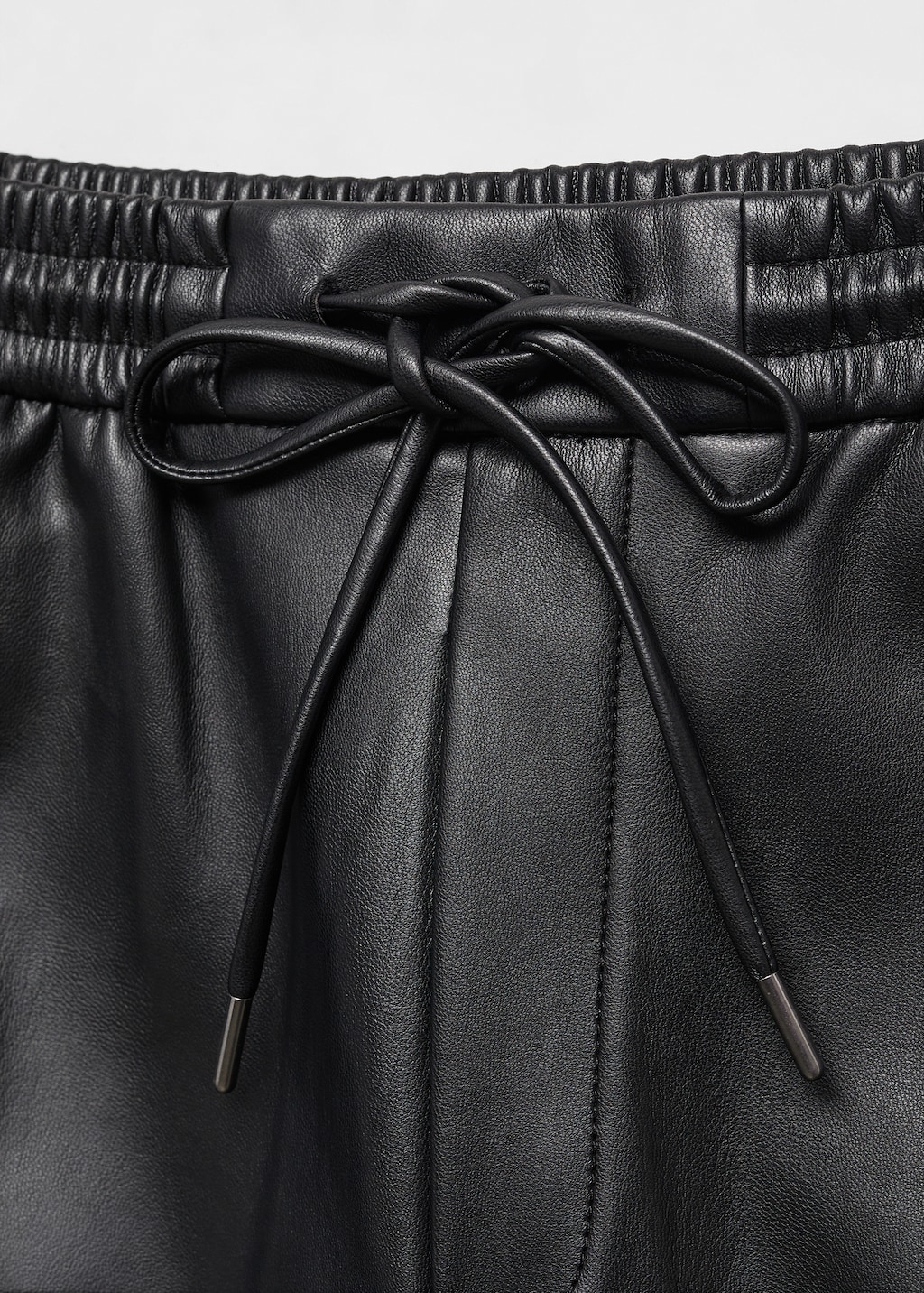 Leather-effect elastic waist trousers - Details of the article 8